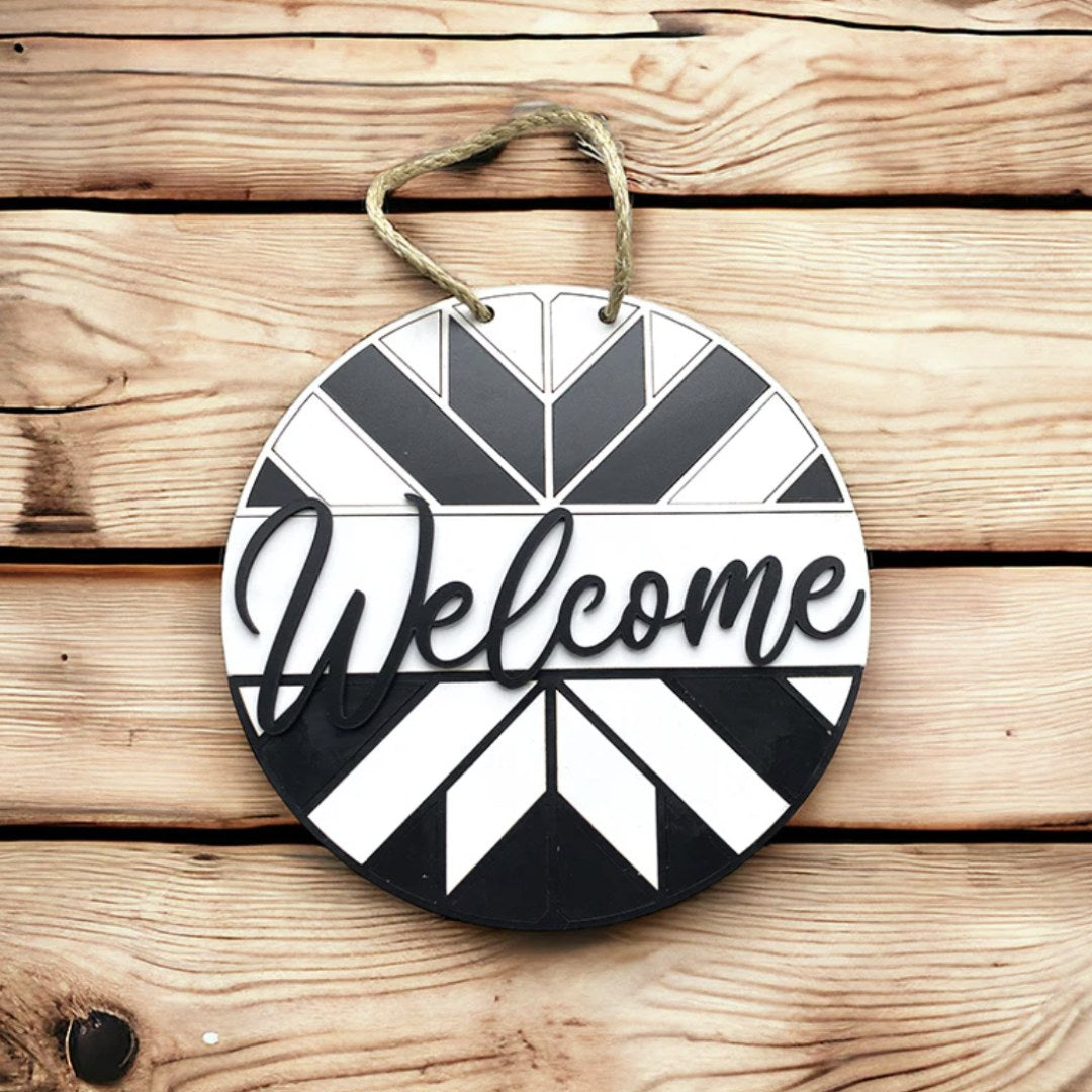 a black and white circular welcome sign made on a laser cutter using Truflat engineered wood sold by Thunder Laser Supply Canada