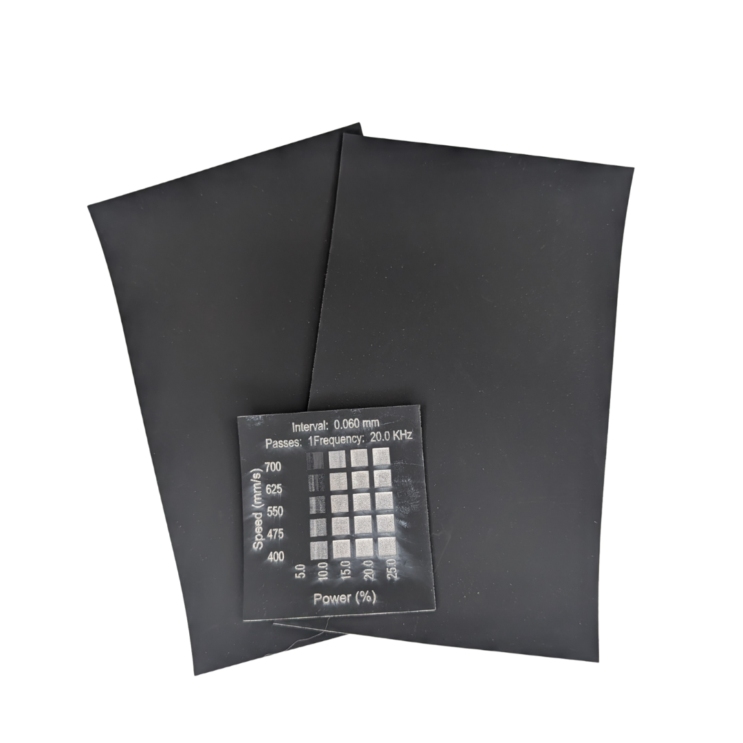 Black white faux leatherette for sale in Canada. Image shows materials test done on a 30w rf Thunder Bolt 
