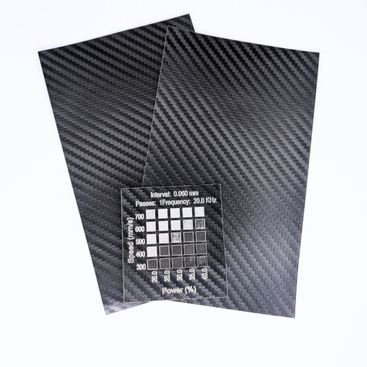 Carbon fiber back and silver faux leatherette for sale in Canada. Materials test shows materials test done on 30w Thunder Bolt laser