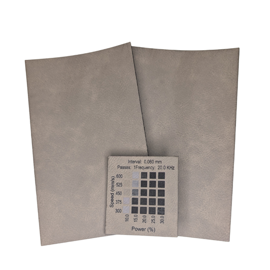 Grey faux leatherette with black engraving, sold in Canada. Materials test done on a 30w rf Thunder Laser Bolt machine