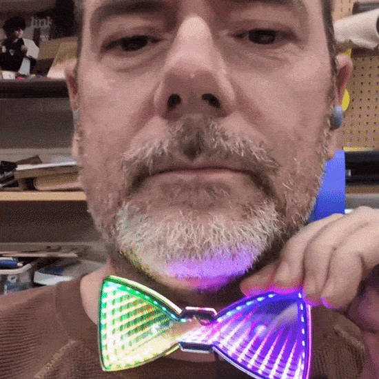 Shannon with infinity mirror tie. Local laser supply canada